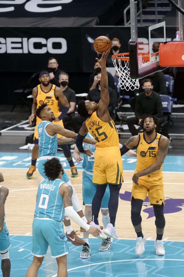 Donovan Mitchell (45) with a layup over Miles Bridges (0)